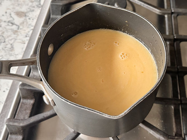 Gummy mixture in a sauce pan on the stove top.