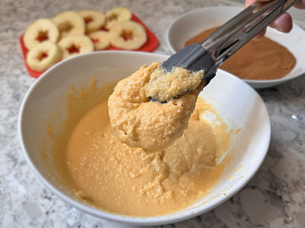 Apple round dipped into pancake batter.