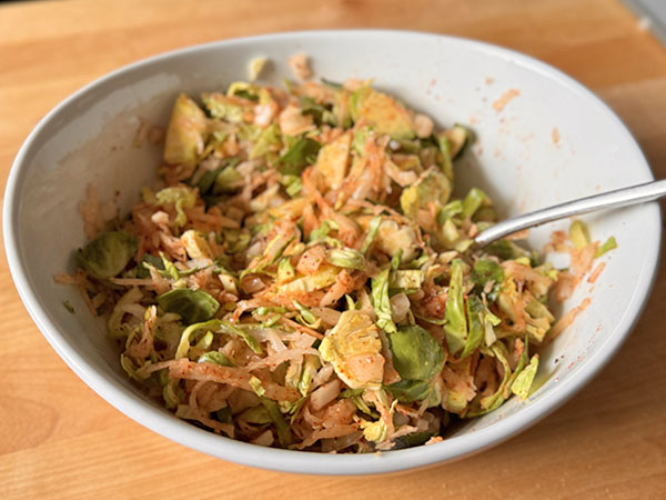 Potato, Brussels sprouts, onions and spices mixture for breakfast hash.