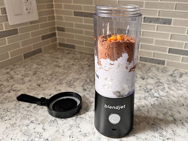 Ingredients for Chocolate Orange Protein Mousse with Cottage Cheese in a blender.