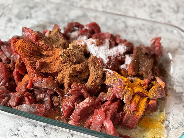Thinly sliced beef strips topped with shawerma seasonings.