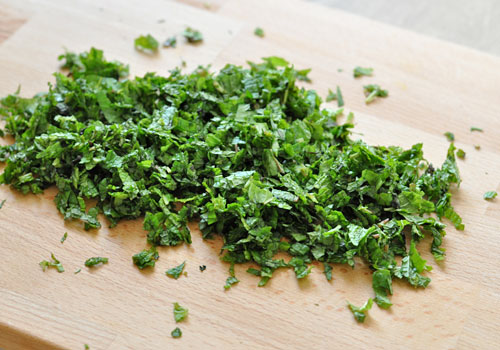 Chopped fresh mint on a cutting board