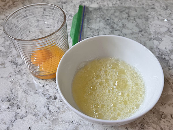 Separated egg yolks and egg whites.