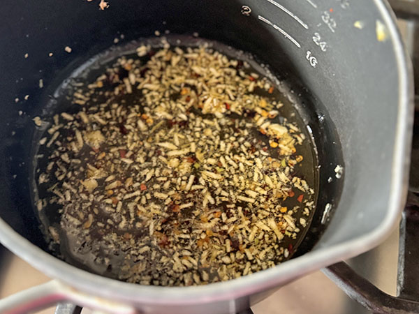 Ghee with crushed red pepper and garlic.