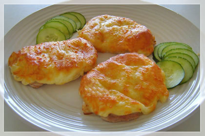 Pork Chops Topped with Onions, Mayo and Cheese