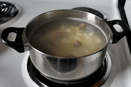 Russian Meatball Soup photo instruction 3 Pot of Russian meatball soup cooking on stove top.