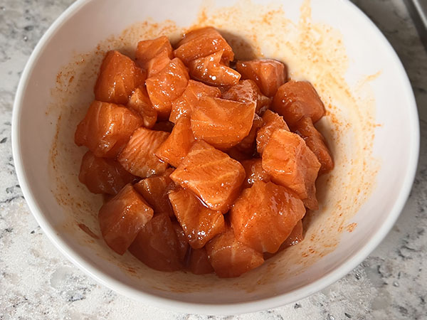Salmon pieces tossed in the mixture of soy sauce, toasted sesame oil, garlic powder and paprika.